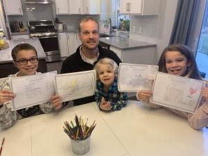Family showing off placemats