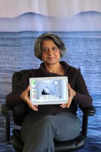 Piali De, Ph.D., CEO of Senscio Systems holding the Ibis tablet.
