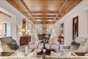 Expertly designed, 2930 Hurlingham Drive's living room boasts views of the courtyard.