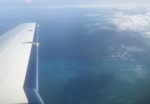 private jet flying to the Caribbean
