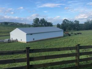 custom built log home on 45± acres with a 5,000 sq. ft. shop, pond, creek, and livestock fencing and a desirable Shenandoah Valley location