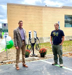 Pend Oreille PUD's Colin Willenbrock and the Greater Newport Area Chamber of Commerce's Jason Totland with SemaConnect EV charging stations