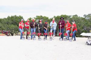 Each year RED Arena holds its annual fundraiser event to share their mission of empowerment and community actualized through horses photo of staff and board members at the ground breaking ceremony for RED Arena's new facility in Dripping Springs, TX