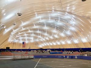 The John Bennett Indoor Athletic Complex, a multi-sport facility operated by Tom’s River Regional School District in Tom’s River, NJ, recently got remarkably brighter with the installation of new LED light fixtures With its huge field area and 200-meter, 6-lane track, the 80,000 square-foot John Bennett Indoor Athletic Complex is designed to host many sporting events, including soccer, basketball, and track and field events “The conversion of the John Bennett Athletic Complex has been remarkable In total, 67 Eclipse™ LED fixtures were installed to replace the metal halides, which had pretty much neared the end of their useful lifecycle “With our LED lighting conversion of the Bennett dome, light distribution, coverage, and brightness are dramatically better now About Green Arc Energy Advisors To date, Green Arc has converted nearly 3 million square feet of commercial, industrial, and academic space About Green Arc’s Patented Eclipse™ LED Lighting Designed specifically for the demanding requirements of air dome/air-inflated structures, butler buildings with reflective ceilings, fabric-over-frame structures, and natatoriums, Eclipse™ is designed with innovative Controlled Light Delivery (CLD) technology™ to deliver brighter output, better light distribution, lower wattage, and run much cooler for enhanced longevity, making them ideal for use over all court and field surfaces TRRS Bennet Dome
